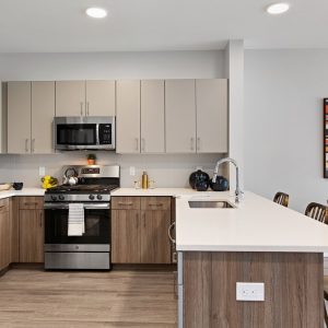 Model unit kitchen featuring modern finishes, and appliances.
